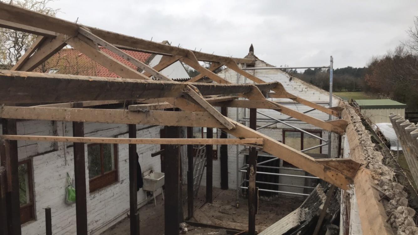 Corrugated asbestos roof sheets removal and disposal in East Lothian by Brown Demolitions Ltd, click here for a corrugated cement asbestos roof sheet removal quote in Scotland